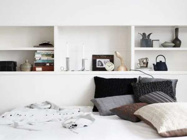 Should You Put Shelves Above A Bed?